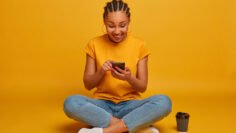 close-up-attractive-carefree-young-woman-sitting-floor