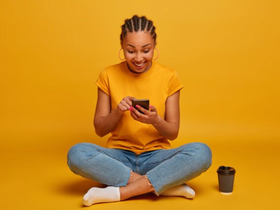 close-up-attractive-carefree-young-woman-sitting-floor